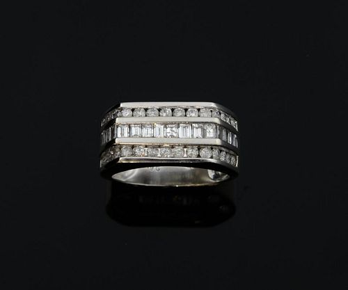 Diamond three row ring with baguette and round brilliant cut diamonds.  Mounted in 9ct white gold. Estimated total diamond we
