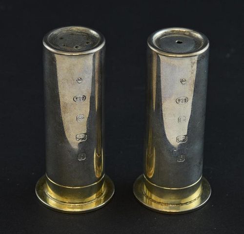 Pair of silver salt and pepper shakers in the form of gun cartridges, on 12 calibre bullet bases, Birmingham 2008, makers Ari