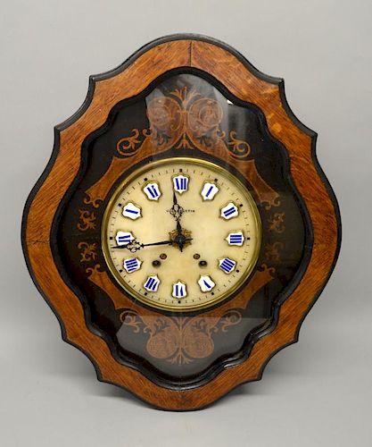 French oak and marquetry inlaid serpentine shaped wall clock, white porcelain and blue enamelled Roman numerals, 61cm x 50cm,