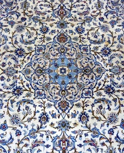 Persian type cream ground carpet with light blue borders, the centre with repeating foliate forms  340cm x 250cm