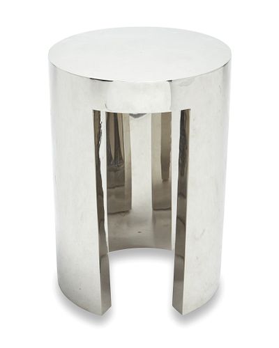 A modern chrome-plated metal side table
