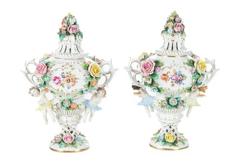 Dresden Porcelain (German) Covered Urns, Raised Flowers And Cupids In Relief C. 1940, H 11.5'' W 8'' 1 Pair
