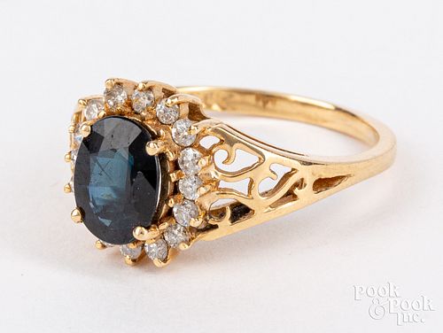 14K yellow gold, sapphire, and diamond halo ring