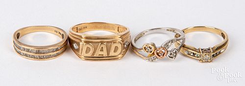 Four 10K gold and diamond rings