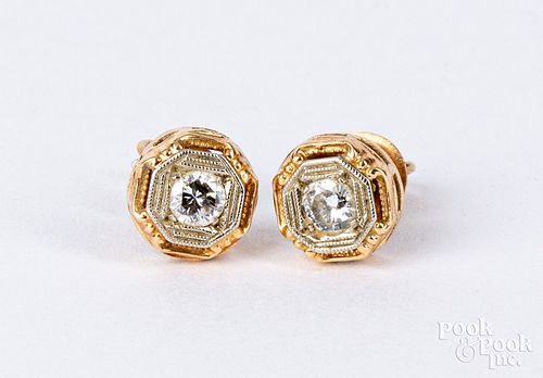 Pair of 14K gold and diamond stud earrings