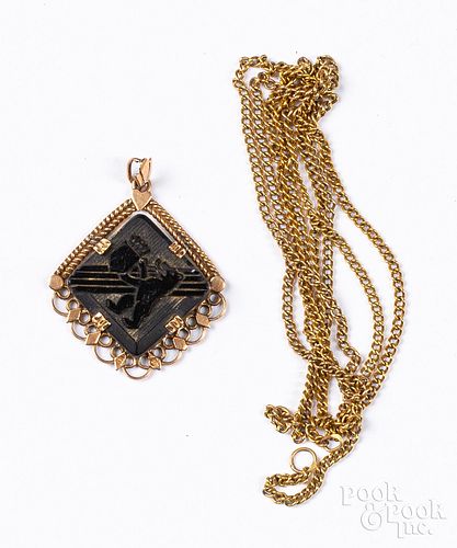 14K gold necklace and 14K gold and onyx pendant