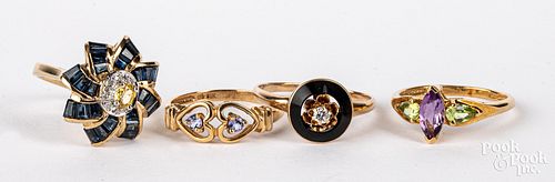 Four 10K gold and gemstone rings