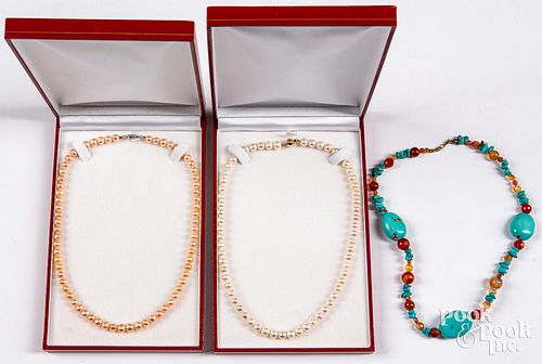 Two pearl necklaces with 14K gold clasps