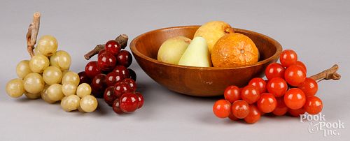 Group of stone fruit and a wooden bowl