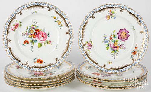 Eleven hand painted porcelain plates