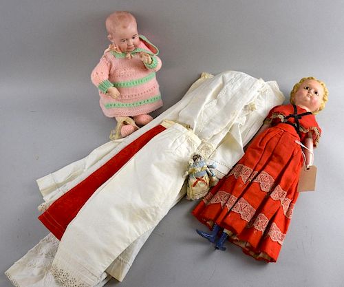 A 19th century doll with composition head, open brown eyes, cloth body and wooden limbs 45cm long, a small quantity of white 