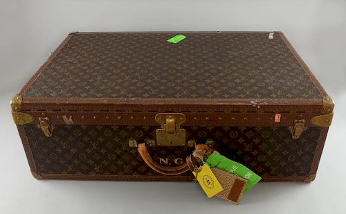 Oasis - Louis Vuitton - A monogrammed hard-sided suit case owned by Noel Gallagher from the English Rock Band Oasis, with pai