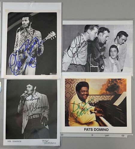Rock 'n' Roll - A collection of four signed stills of rock & roll artists, including; Chuck Berry, Jerry Lee Lewis, Fats Domi
