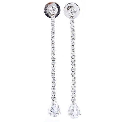 Approx. 4.30 Carat Diamond and Platinum Dangle Earrings each set with an approx. 1.30 Carat Pear Shape Diamond