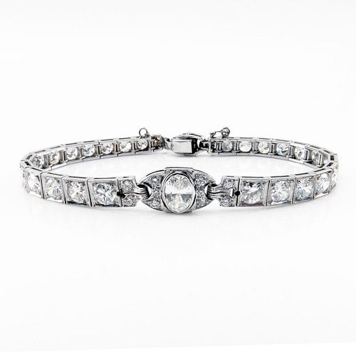 Art Deco Approx. 8.25 Carat Old European Cut Diamond and Platinum Bracelet Set in the Center with an approx. 1.0 Carat Oval C