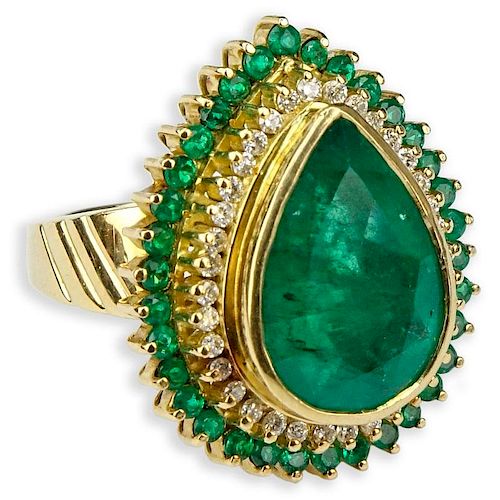 7.50 Carat Pear Shape Colombian Emerald and 18 Karat Yellow Gold Ring accented with .50 Carat Round Brilliant Cut Diamonds an