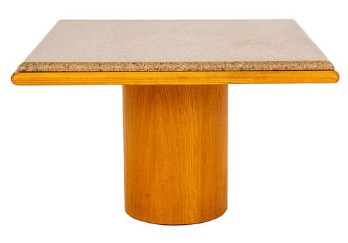 Angelo Donghia (American, 1935-1985) post modern style square granite and ash wood pedestal table, 1980s, the square gray granite top above an ash top