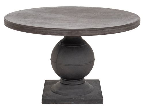Made Goods "Cyril" concrete round dining table raised on carved pedestal in age gray reconstitute stone finish. 29" H x 48" Diameter