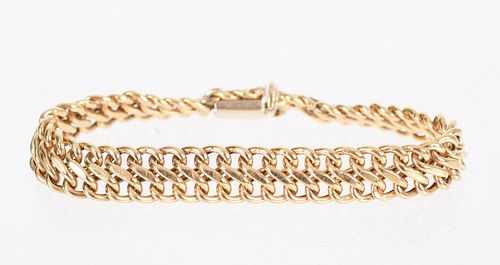 An 18k Gold Fancy Curb Link Bracelet