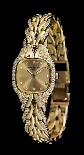 An 18 Karat Yellow Gold and Diamond Ref. 4715/003 La Flamme Wristwatch, Patek Philippe, Circa 1987,