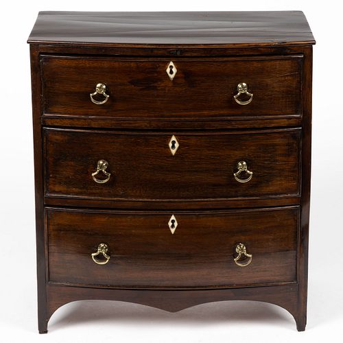 LATE GEORGIAN MAHOGANY BOW-FRONT MINIATURE CHEST OF DRAWERS