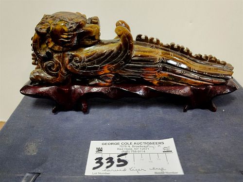 CARVED TIGER EYE DRAGON 2 3/4"H X 8 1/2"L X 1 1/2"W ON STAND