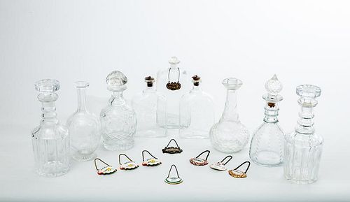 Nine Assorted Glass Decanters and Stoppers and Nine Liquor Labels