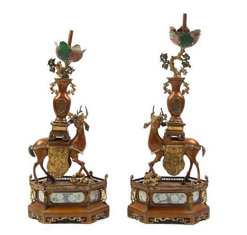A Pair of Chinese Export Patinated Metal Figural Candlesticks, Height 16 3/4 inches.