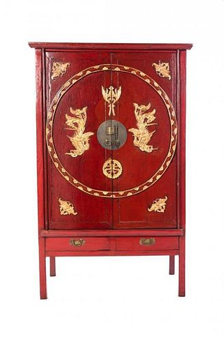 A Chinese Red Lacquered Cabinet, Height 61 1/4 x width 41 1/2 x depth 20 1/2 inches.