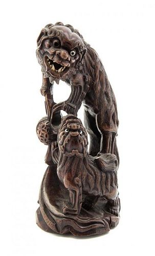 A Chinese Carved Hardwood Figural Group, Height 11 inches.