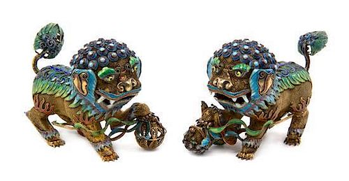 A Pair of Chinese Enameled Silver Figures of Temple Lions, Width of wider 4 1/2 inches.