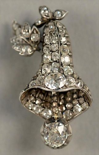 14K white gold brooch in form of a bell encrusted with diamonds including one diamond approximately .70cts and one approximat