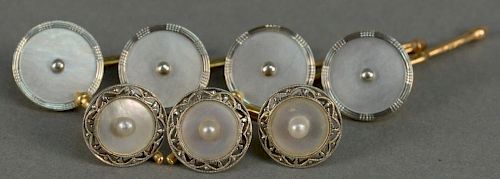 Seven piece gold and mother of pearl cufflink and button set.