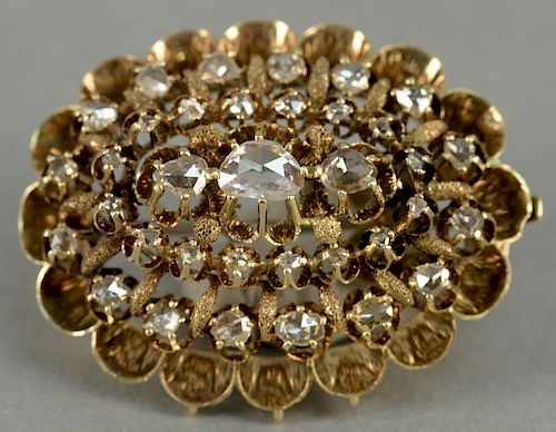 Georgian 10K gold oval form brooch set with 35 rose cut diamonds, 19th century or earlier.
