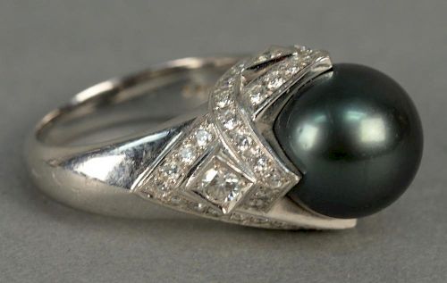 Mikimoto platinum ring set with large black pearl 12mm surrounded by diamonds. 
total weight 20.7 grams