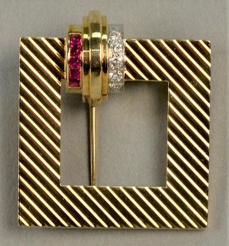 14K Tiffany & Co. buckle style brooch set with five rubies and six diamonds. 
total weight 14.7 grams