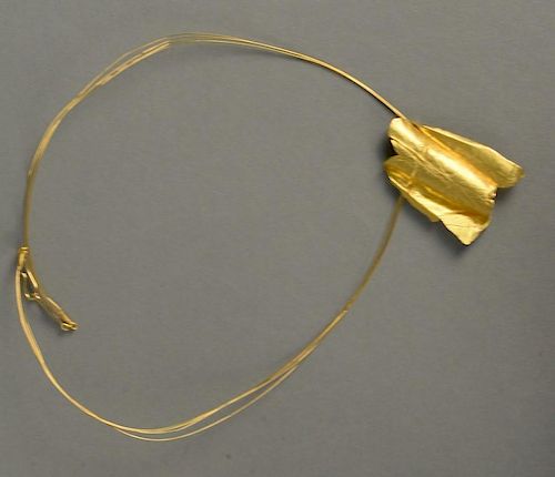 24K gold necklace with contemporary free form design pendant and plain gold strands, signed Richard Fishman 1979. 
27 grams