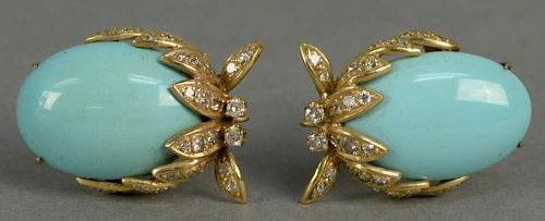 Pair of 14K gold clip earrings, each set with oval turquoise and thirty diamonds.  total weight 17.8 grams