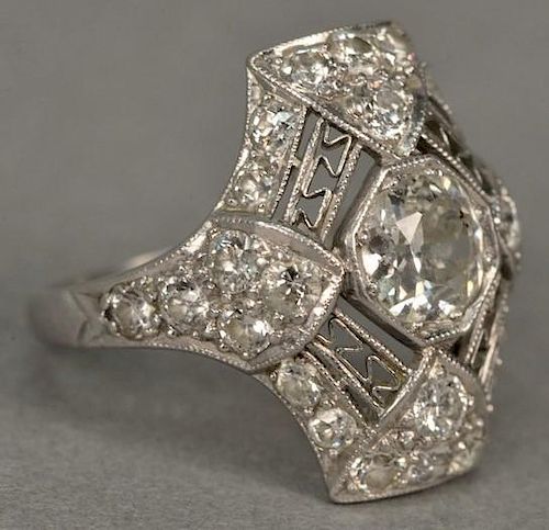 Platinum and diamond ring having center diamond approximately 1ct. surround by twenty-six smaller diamonds, center diamond ha