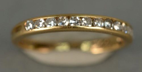 18K gold Tiffany channel band set with diamonds.