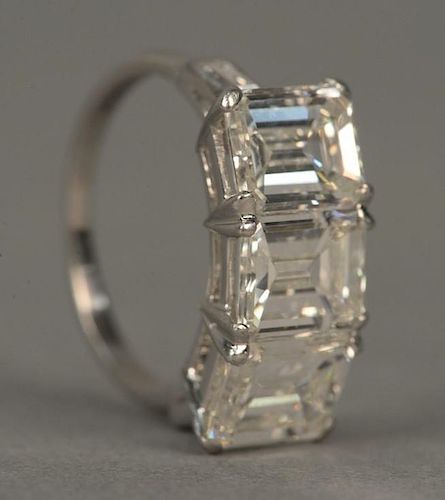 Platinum three stone diamond ring set with three emerald cut diamonds, each approximately 1.8cts. to 1.9cts. each, approximat
