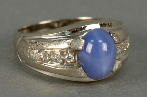 14K white gold ring set with blue star sapphire.