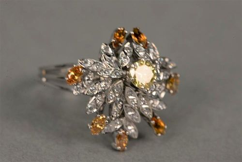 18K white gold cocktail ring set with center yellow diamonds surrounded by small diamonds and citrines, yellow diamond approx
