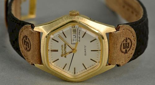 Bulova 14K gold Accutron mens wristwatch, octagon with leather band and gold buckle.