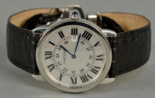 Cartier stainless man's wristwatch with original leather band in original box.
