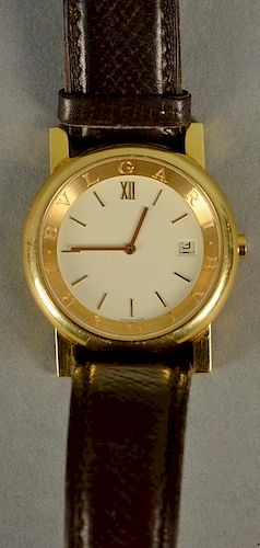 Bulgari 18K gold wristwatch with original Bulgari leather band, time and date with 18K buckle.