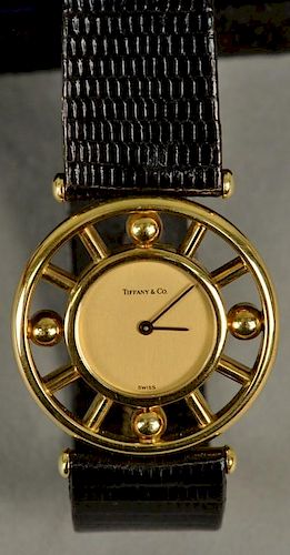 Tiffany 18K gold wristwatch, Palomba Picasso model with original band and original box.