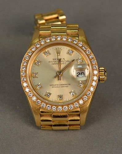Rolex 18K gold ladies wristwatch, Oyster Perpetual Datejust superlative chronometer, the face with diamond surround and diamo