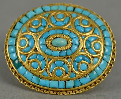 18K gold brooch set with Persian turquoise.