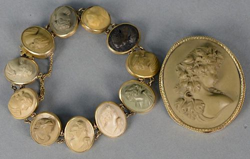 Victorian Lava cameo set, bust of a woman brooch pin with gold case and a bracelet with eleven small cameos of different colo